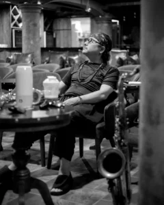 musician sits in a chair waiting to start