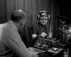Musician Tran Manh Tuan and his producer work out the details on the new song.