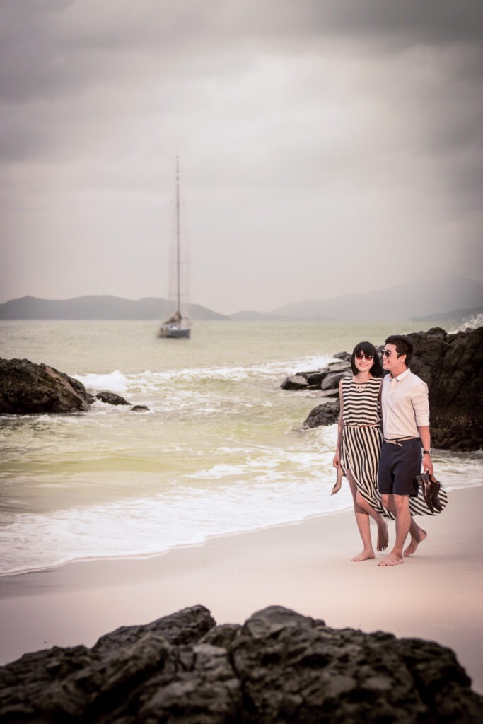 Couple walking on a secluded beach